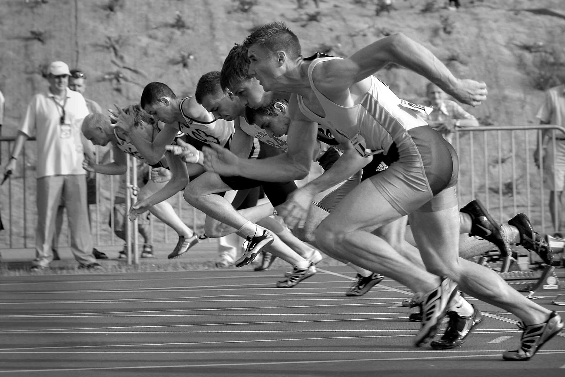 runners on a track starting a race